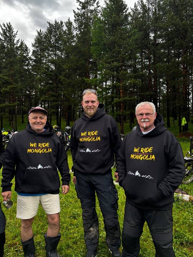 Three riders in We Ride Mongolia hoodies