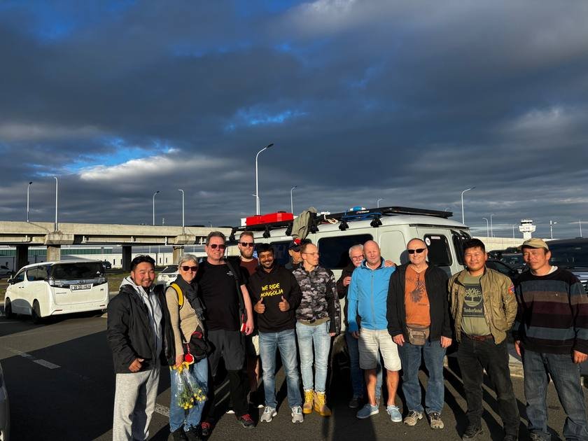 Riders and local team with the support van